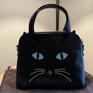 kate spade Black Satchel with Light Blue Eye Accents